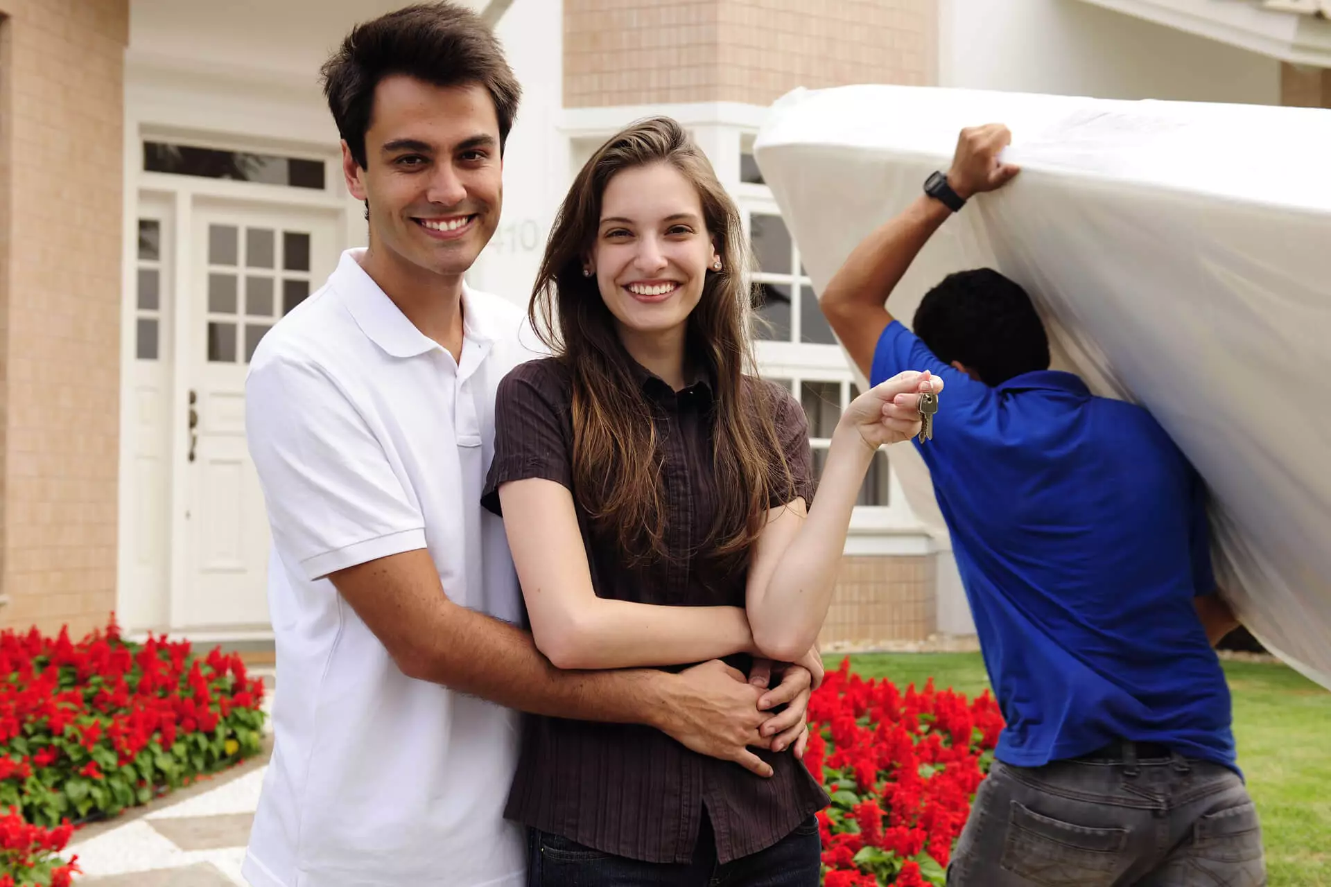 Moving home Couple infront of new house